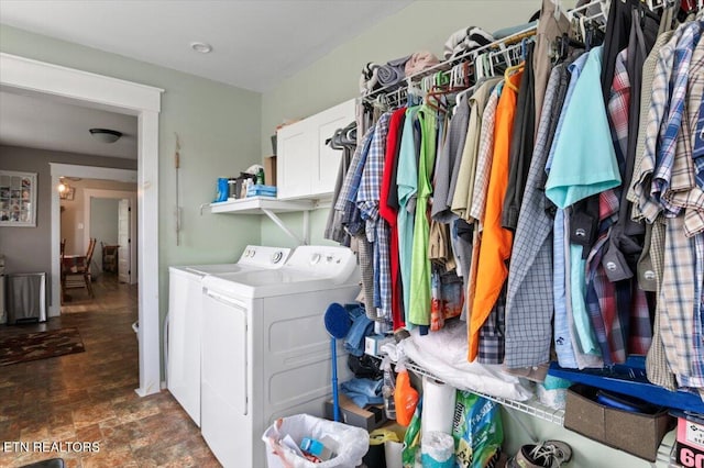 245 Lake Shore Ln, Lafollette, TN 37766 - laundry area with washing machine and clothes dryer, cabinet space, and stone finish flooring