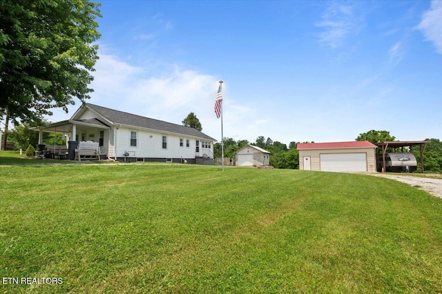 245 Lake Shore Ln, Lafollette, TN 37766 - view of front of house with driveway, a carport, an outbuilding, a garage, and a front lawn