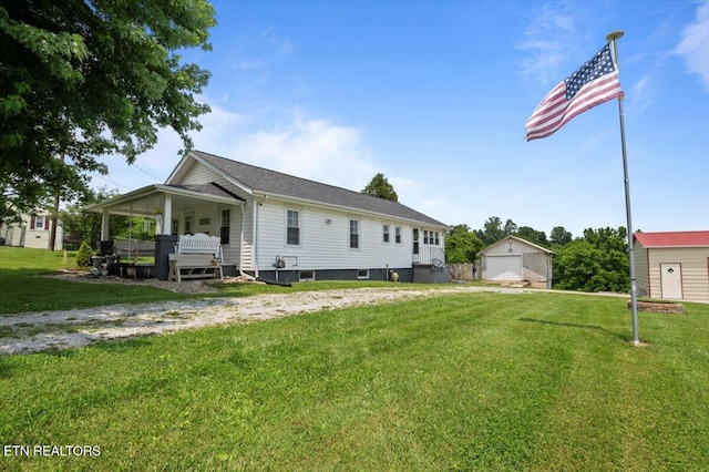 245 Lake Shore Ln, Lafollette, TN 37766 - view of front of property with an outbuilding, a garage, and a front yard