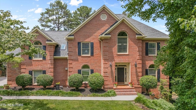 11919 Burnside Pl, Knoxville, TN 37934 - colonial-style house featuring brick siding and roof with shingles
