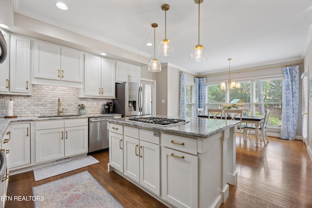 11919 Burnside Pl, Knoxville, TN 37934 - kitchen featuring stainless steel appliances, a sink, white cabinets, backsplash, and dark wood-type flooring