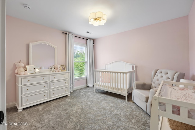 11919 Burnside Pl, Knoxville, TN 37934 - carpeted bedroom featuring a crib and baseboards