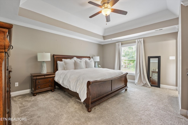 11919 Burnside Pl, Knoxville, TN 37934 - bedroom with a tray ceiling, light carpet, baseboards, ceiling fan, and crown molding