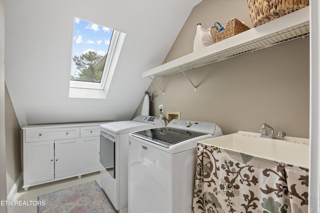 11919 Burnside Pl, Knoxville, TN 37934 - laundry area with separate washer and dryer, a skylight, and cabinet space