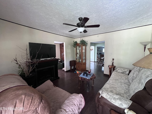 151 Davis Rd, Sneedville, TN 37869 - living area with wood finished floors, a ceiling fan, and a textured ceiling