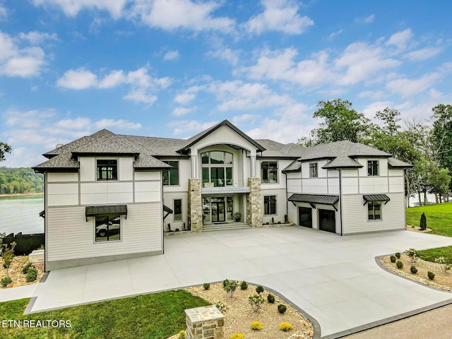 201 Crown Jewel Ln, Lafollette, TN 37766 - back of property featuring roof with shingles, an attached garage, and concrete driveway
