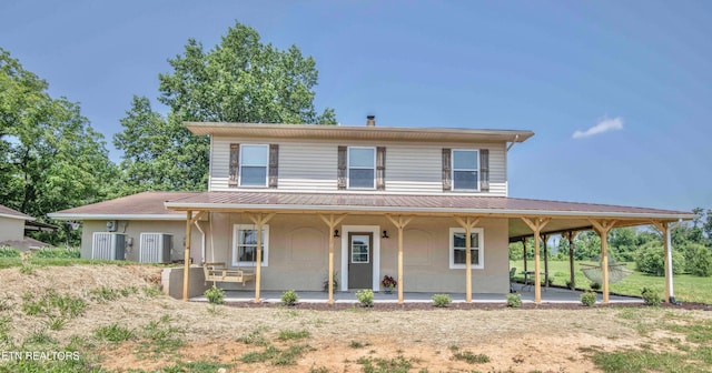 1844 Jackson Rd, Rutledge, TN 37861 - farmhouse inspired home with metal roof, a porch, and cooling unit