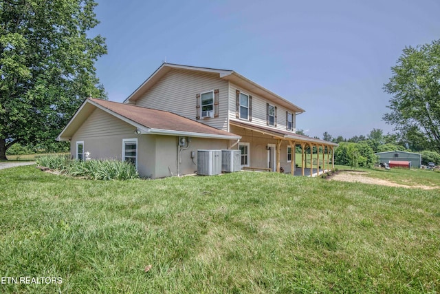 1844 Jackson Rd, Rutledge, TN 37861 - back of house with a yard, stucco siding, and central AC unit