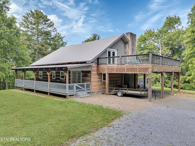 4620 Teague Branch Rd, Hartford, TN 37753 - view of front of house featuring french doors, a deck, a front yard, gravel driveway, and a chimney