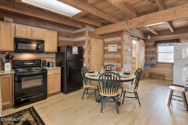 1918 Charles Lewis Way Unit 3, Sevierville, TN 37876 - kitchen featuring black appliances, wood ceiling with exposed beams, light wood finished floors, wooden walls, and light brown cabinetry
