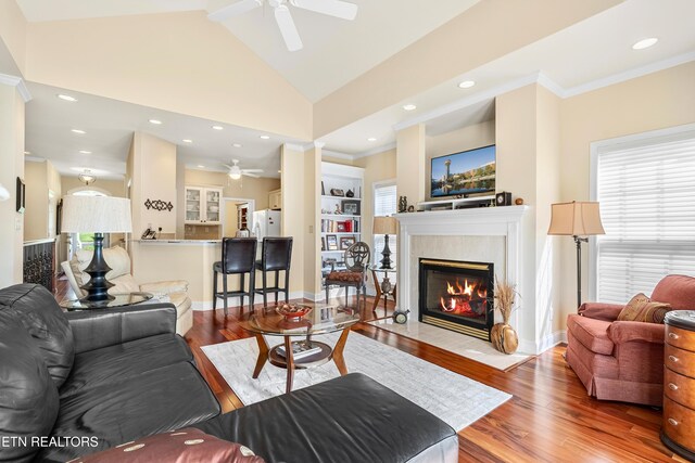 460 Morning Dove Dr, Vonore, TN 37885 - living area with ceiling fan, a fireplace, wood finished floors, vaulted ceiling, and crown molding