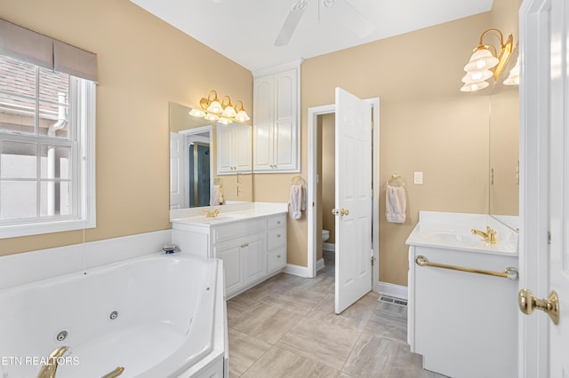 460 Morning Dove Dr, Vonore, TN 37885 - bathroom featuring two vanities, a whirlpool tub, a ceiling fan, and toilet