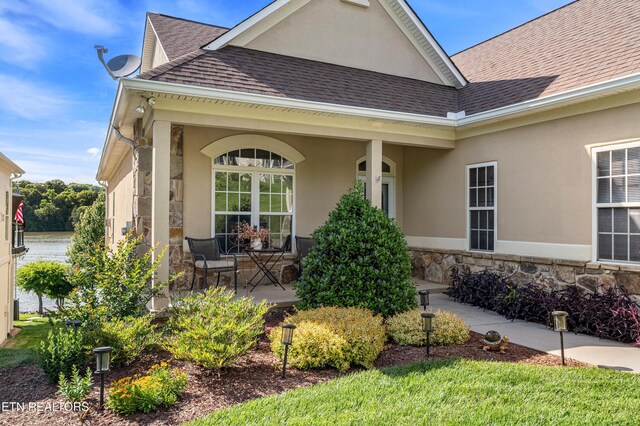 460 Morning Dove Dr, Vonore, TN 37885 - view of front of house with roof with shingles, covered porch, stone siding, and stucco siding
