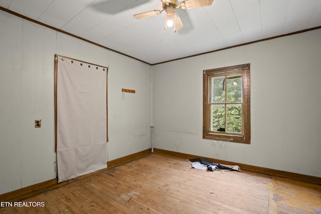 138 Bethlehem Ln, Lafollette, TN 37766 - unfurnished room featuring wood-type flooring, ornamental molding, ceiling fan, and baseboards