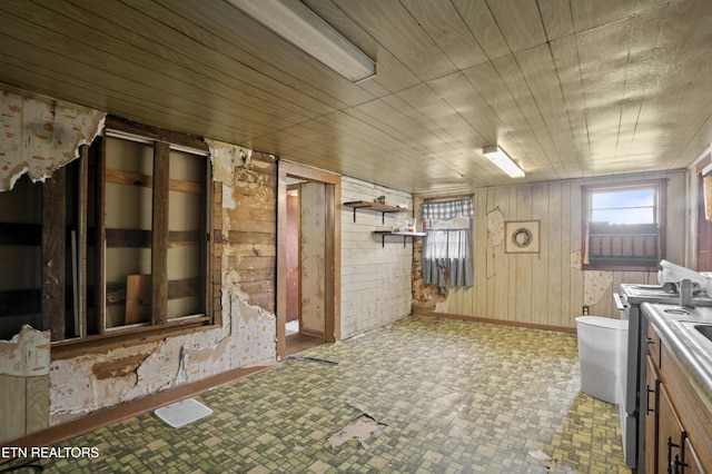 138 Bethlehem Ln, Lafollette, TN 37766 - kitchen with wooden walls, baseboards, and open shelves