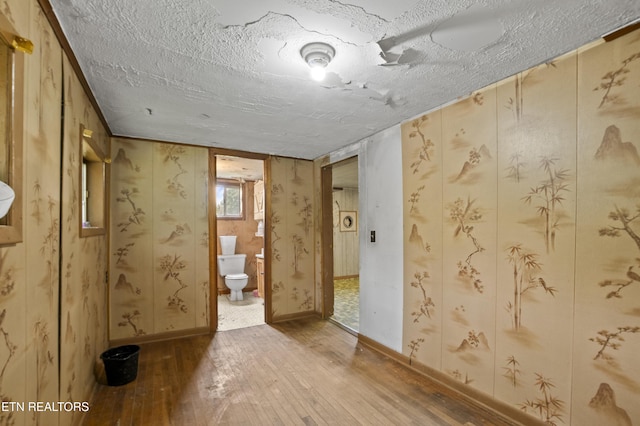 138 Bethlehem Ln, Lafollette, TN 37766 - empty room featuring hardwood / wood-style flooring, a textured ceiling, and baseboards