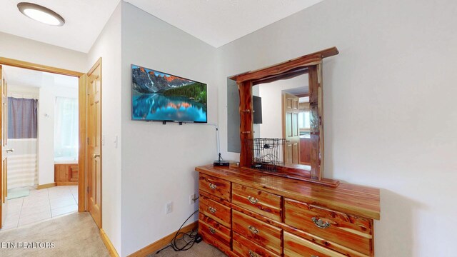 1464 Blue Mill Rd, Del Rio, TN 37727 - hallway featuring baseboards, light colored carpet, and light tile patterned floors