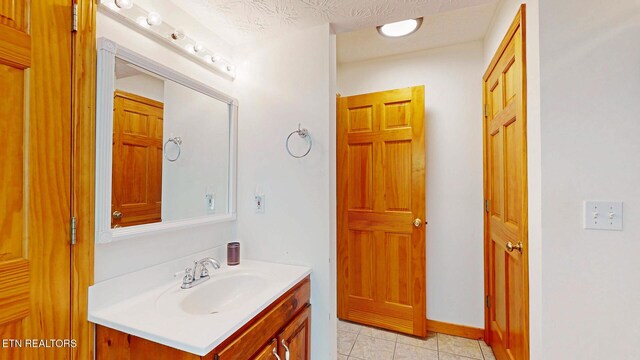 1464 Blue Mill Rd, Del Rio, TN 37727 - bathroom featuring vanity, tile patterned floors, and baseboards