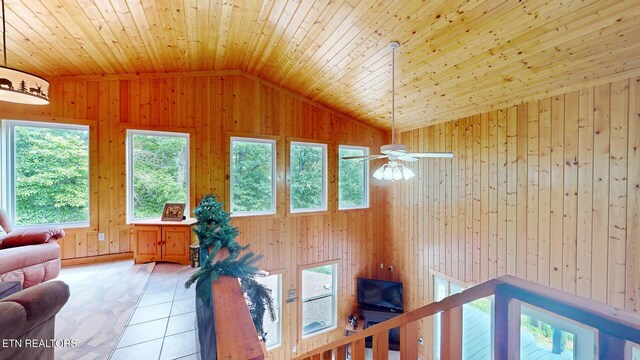 1464 Blue Mill Rd, Del Rio, TN 37727 - living room featuring vaulted ceiling, wooden walls, ceiling fan, wood ceiling, and light tile patterned flooring