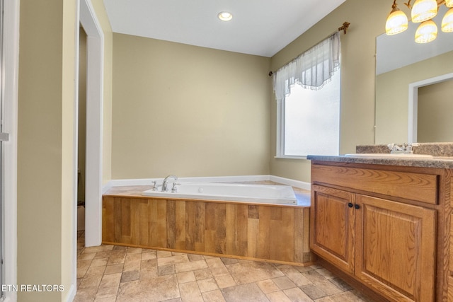 1707 Brookview Dr, Dandridge, TN 37725 - bathroom featuring vanity, a garden tub, stone finish flooring, and recessed lighting