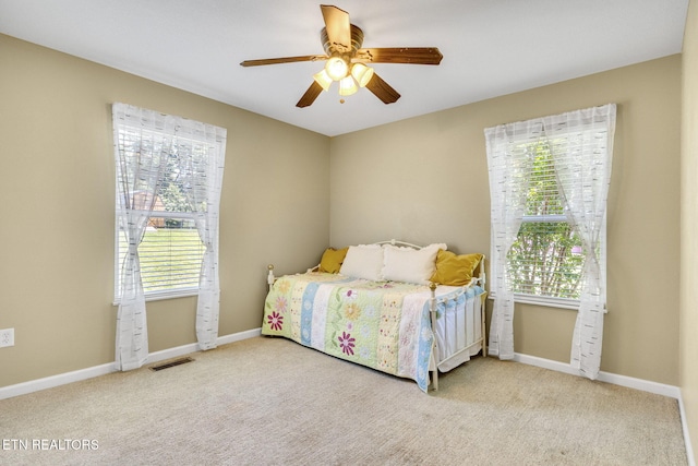 1707 Brookview Dr, Dandridge, TN 37725 - carpeted bedroom featuring multiple windows, baseboards, and ceiling fan