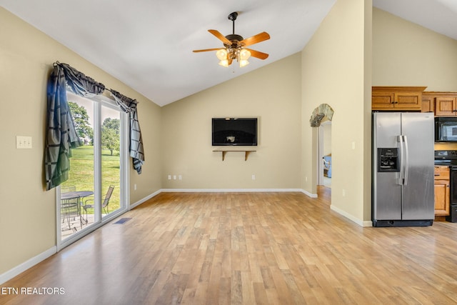 1707 Brookview Dr, Dandridge, TN 37725 - unfurnished living room with light wood-style floors, ceiling fan, baseboards, and high vaulted ceiling