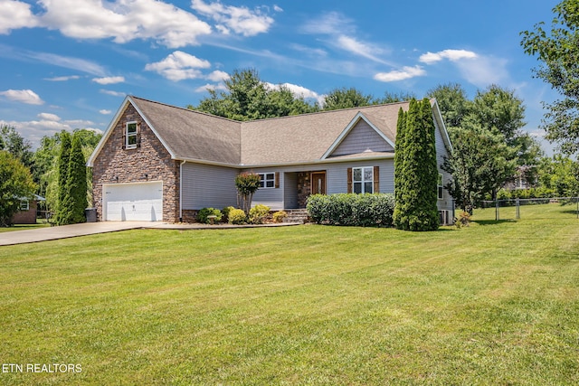 1707 Brookview Dr, Dandridge, TN 37725 - view of front facade featuring driveway, stone siding, an attached garage, and roof with shingles