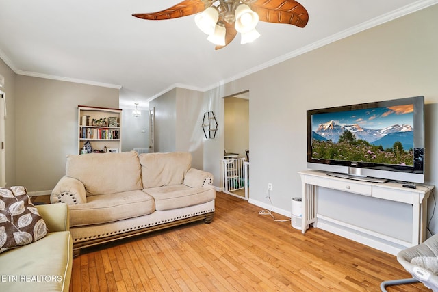 3341 Tabor Loop, Crossville, TN 38571 - living room with a ceiling fan, crown molding, light wood-style floors, and baseboards