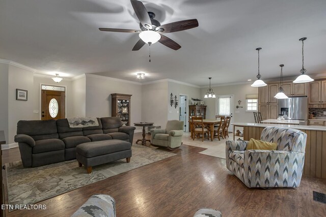 226 Oostanali Way, Loudon, TN 37774 - living area featuring ceiling fan, wood finished floors, baseboards, and crown molding