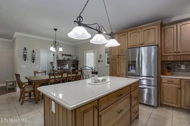 226 Oostanali Way, Loudon, TN 37774 - kitchen with stainless steel refrigerator with ice dispenser, light tile patterned flooring, tasteful backsplash, a center island, and ornamental molding