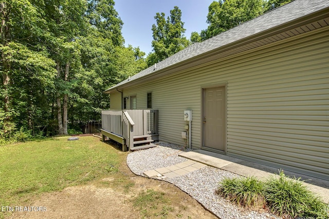 226 Oostanali Way, Loudon, TN 37774 - doorway to property featuring a shingled roof, a yard, and a wooden deck