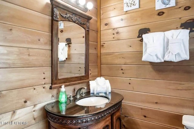 1056 Black Bear Cub Way, Sevierville, TN 37862 - half bathroom featuring wooden walls and vanity