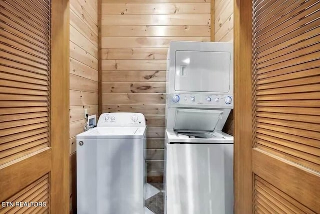 1056 Black Bear Cub Way, Sevierville, TN 37862 - laundry area featuring estacked washer and dryer and wooden walls