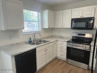 6206 Jim Fox Ln, Powell, TN 37849 - kitchen with black appliances, a sink, and white cabinetry