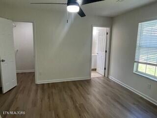 6206 Jim Fox Ln, Powell, TN 37849 - empty room with wood finished floors, ceiling fan, and baseboards