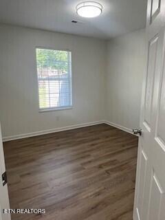 6206 Jim Fox Ln, Powell, TN 37849 - empty room featuring wood finished floors and baseboards