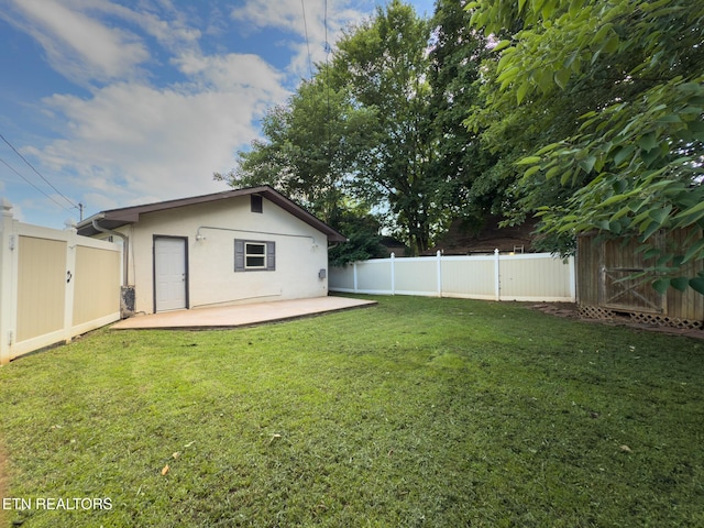104 Church St, Loudon, TN 37774 - back of property featuring a patio area, stucco siding, and a fenced backyard