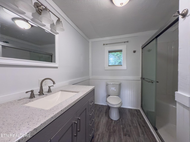 104 Church St, Loudon, TN 37774 - bathroom with vanity, a shower with door, wood finished floors, and wainscoting