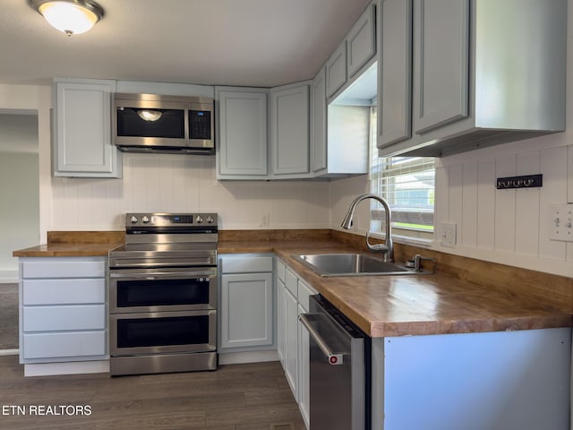 104 Church St, Loudon, TN 37774 - kitchen with appliances with stainless steel finishes, wood counters, and dark wood-style floors