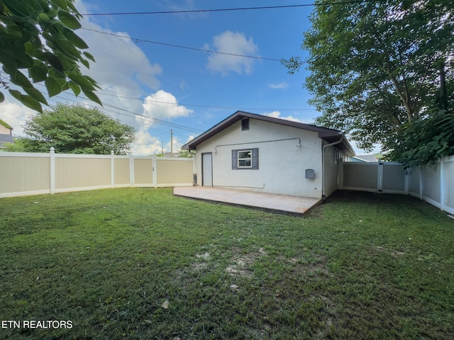 104 Church St, Loudon, TN 37774 - rear view of property with stucco siding, a patio, and a fenced backyard