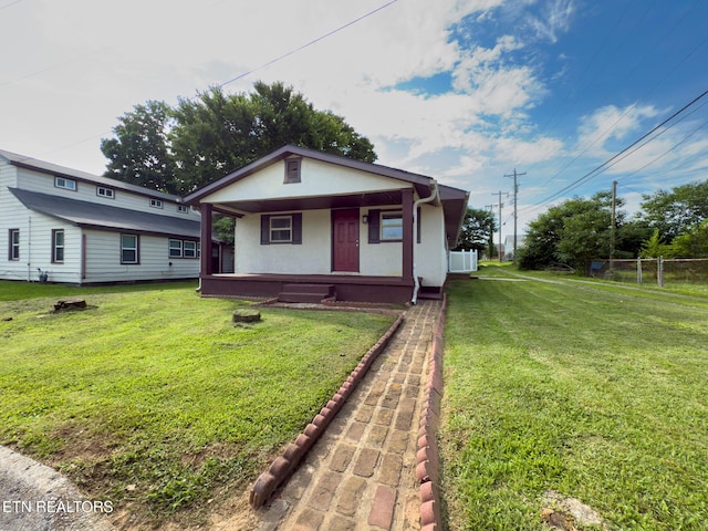104 Church St, Loudon, TN 37774 - bungalow featuring covered porch and stucco siding
