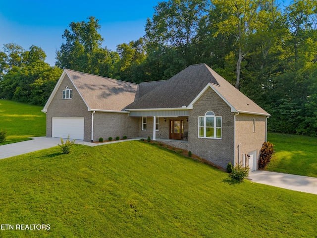 4153 Harbor View Dr, Morristown, TN 37814 - view of front of home with concrete driveway, a front lawn, an attached garage, and brick siding