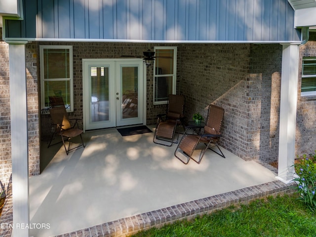 4153 Harbor View Dr, Morristown, TN 37814 - property entrance featuring french doors, a patio, board and batten siding, and brick siding