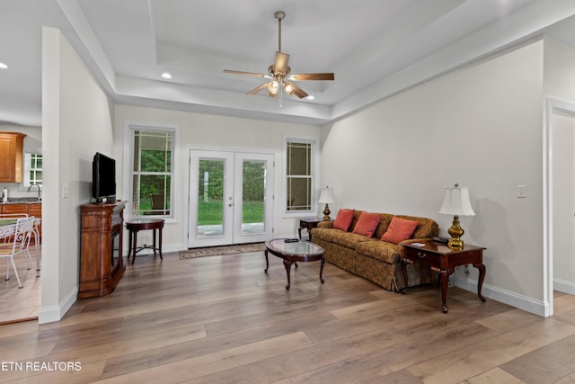 4153 Harbor View Dr, Morristown, TN 37814 - living room featuring a ceiling fan, light wood-style flooring, a raised ceiling, recessed lighting, and baseboards
