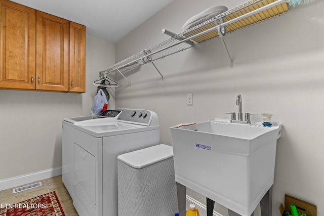 4153 Harbor View Dr, Morristown, TN 37814 - laundry room with cabinet space, washing machine and dryer, and baseboards