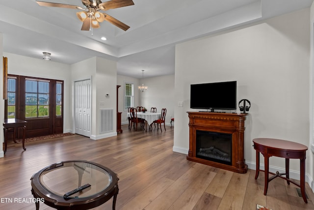 4153 Harbor View Dr, Morristown, TN 37814 - living area featuring a tray ceiling, hardwood / wood-style flooring, plenty of natural light, baseboards, and recessed lighting