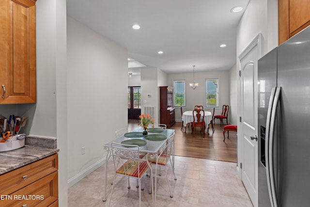 4153 Harbor View Dr, Morristown, TN 37814 - kitchen with stainless steel fridge with ice dispenser, brown cabinets, recessed lighting, dark stone counters, and baseboards