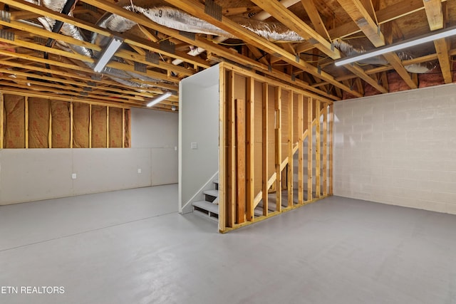 4153 Harbor View Dr, Morristown, TN 37814 - unfinished below grade area featuring concrete block wall and stairs