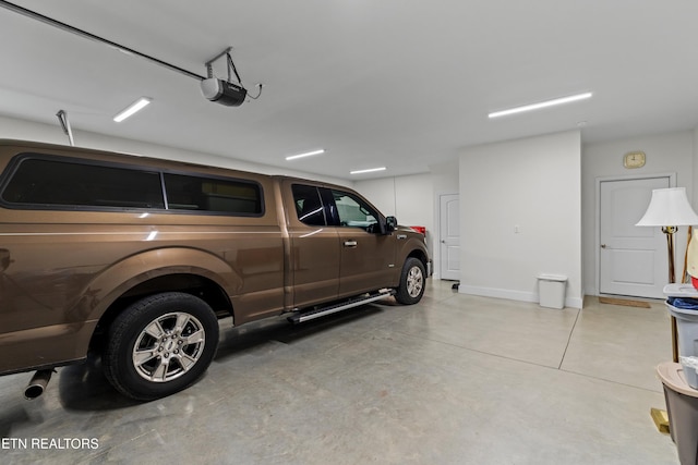 4153 Harbor View Dr, Morristown, TN 37814 - garage featuring a garage door opener and baseboards