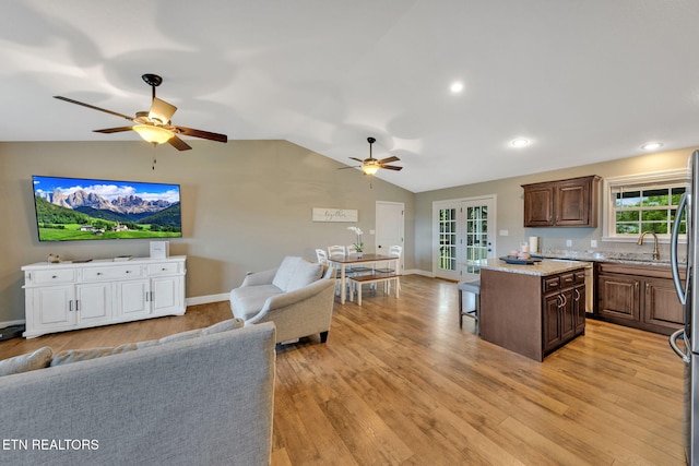 142 Breezy Ln, New Tazewell, TN 37825 - kitchen featuring open floor plan, a ceiling fan, a breakfast bar, french doors, and vaulted ceiling